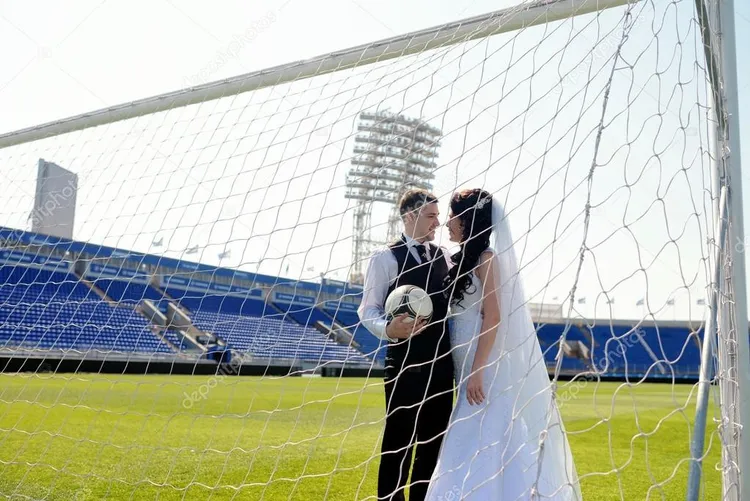 /images/d/e/p/depositphotos_104840306-stock-photo-wedding-couple-on-football-stadium.jpg